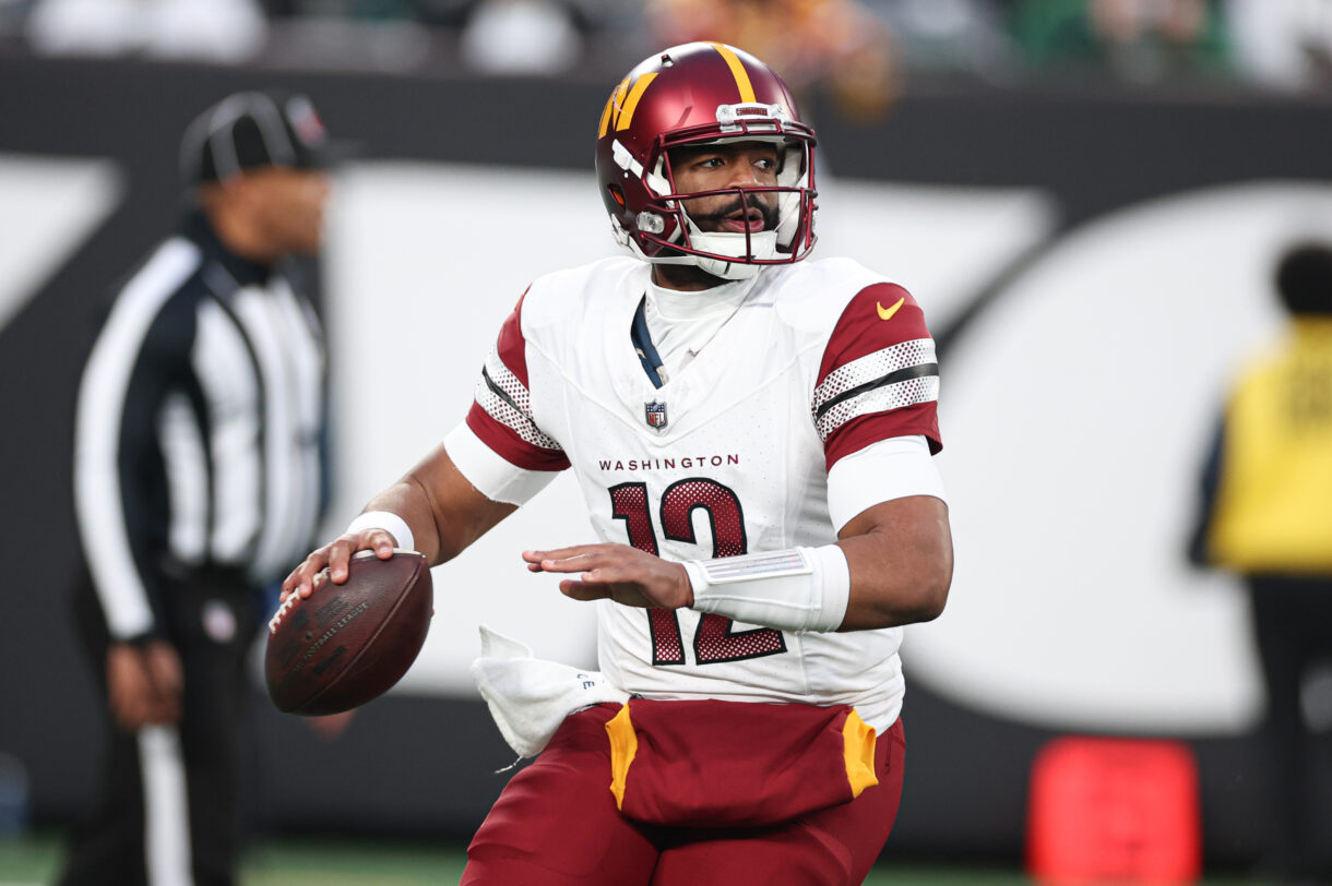 Washington Commanders quarterback Jacoby Brissett (12) throws the ball during the second half against the New York Jets at MetLife Stadium