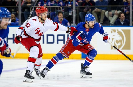 New York Rangers center Vincent Trocheck (16) and Carolina Hurricanes center Jesperi Kotkaniemi (82) chase the puck during the first period at Madison Square Garden