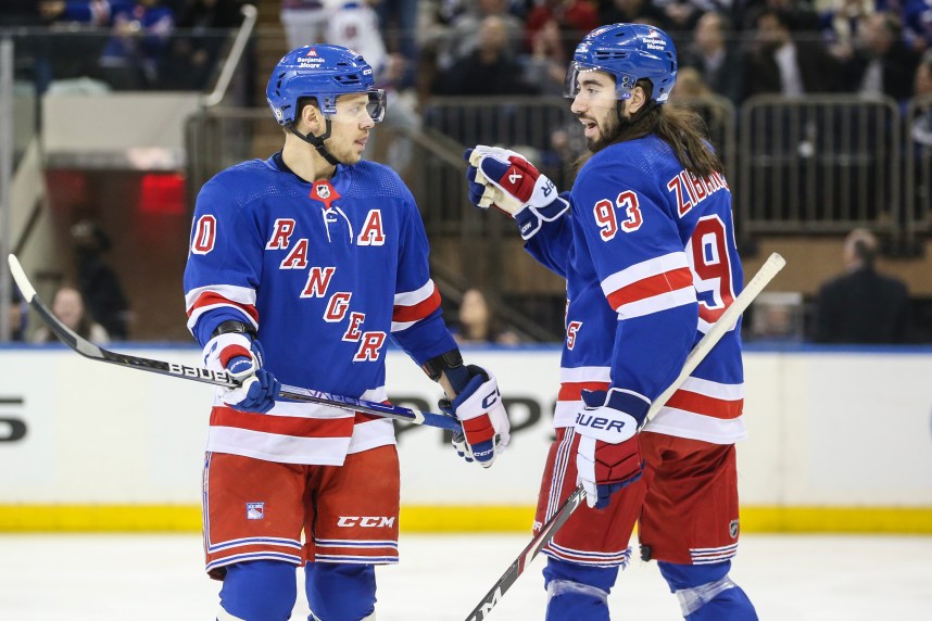 New York Rangers left wing Artemi Panarin (10) and center Mika Zibanejad (93) talk at the start of the game against the Vancouver Canucks at Madison Square Garden