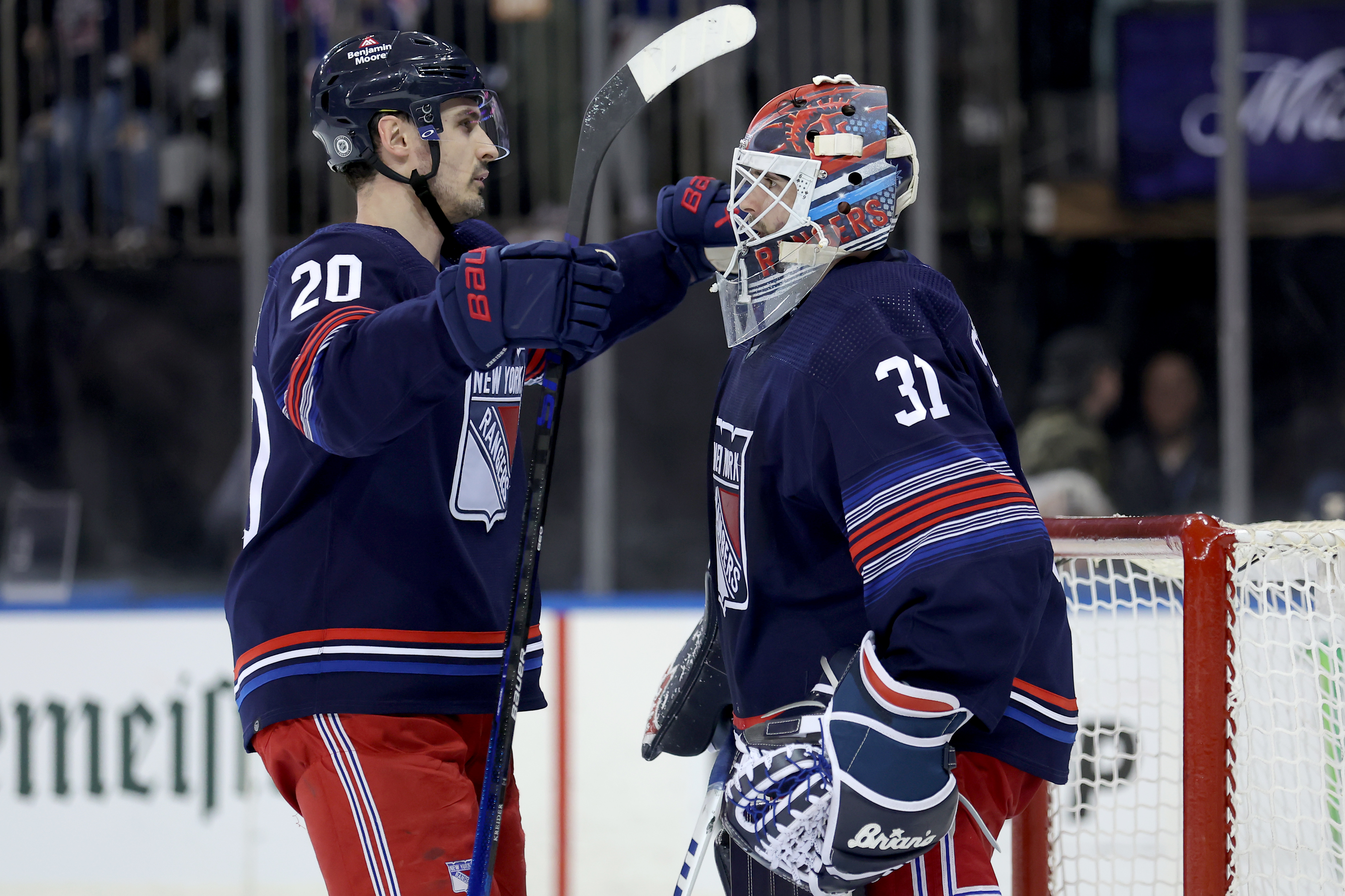 New York Rangers left wing Chris Kreider (20) hugs goaltender Igor Shesterkin (31) after defeating the Washington Capitals at Madison Square Garden