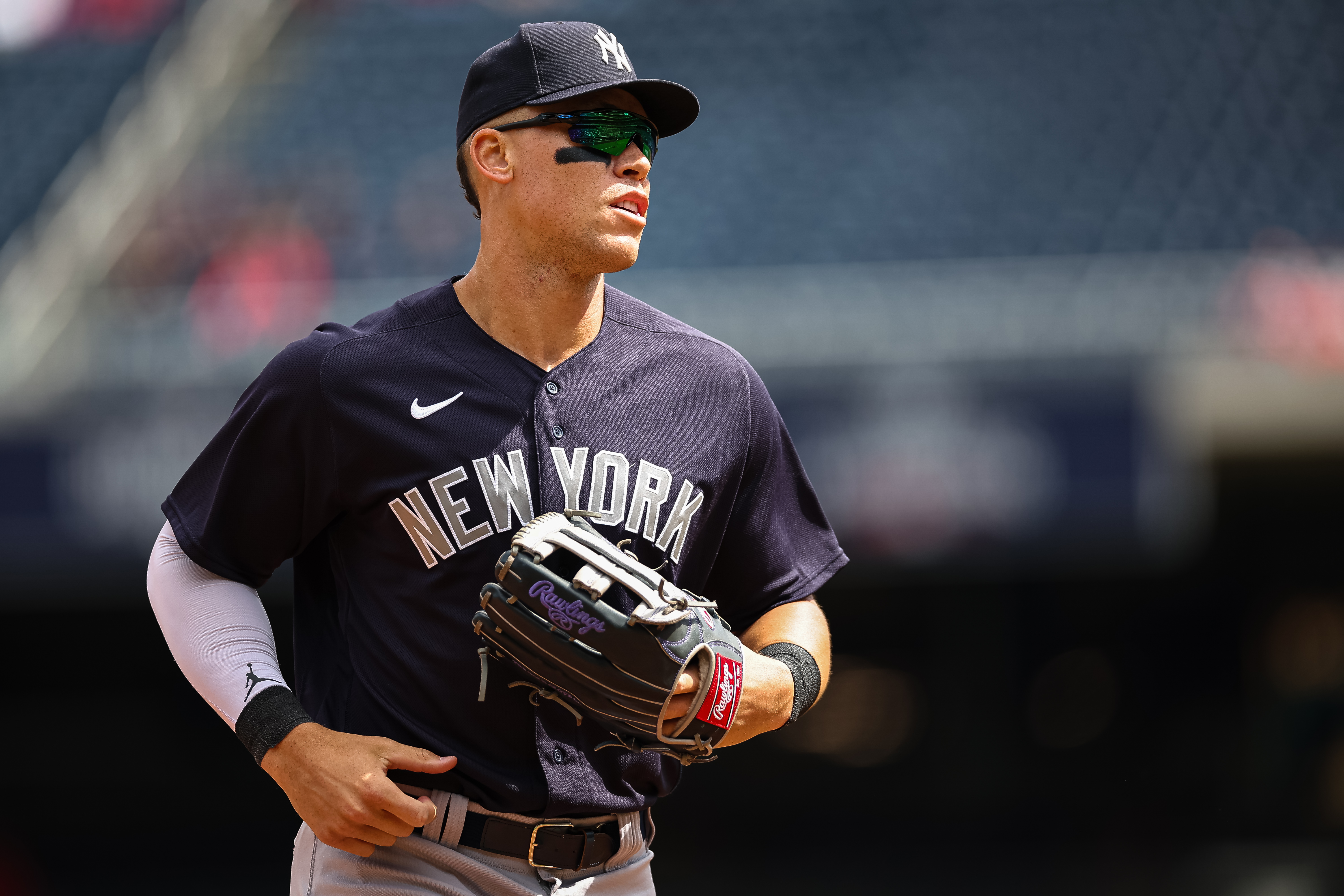 New York Yankees center fielder Aaron Judge (99) looks on against the Washington Nationals during the second inning of the Spring Training game at Nationals Park