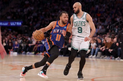 New York Knicks guard Jalen Brunson (11) drives to the basket against Boston Celtics guard Derrick White (9) during the third quarter at Madison Square Garden