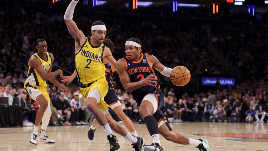 New York Knicks guard Miles McBride (2) drives to the basket against Indiana Pacers guard Andrew Nembhard (2) during the fourth quarter at Madison Square Garden