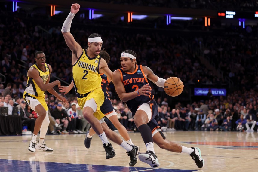 New York Knicks guard Miles McBride (2) drives to the basket against Indiana Pacers guard Andrew Nembhard (2) during the fourth quarter at Madison Square Garden
