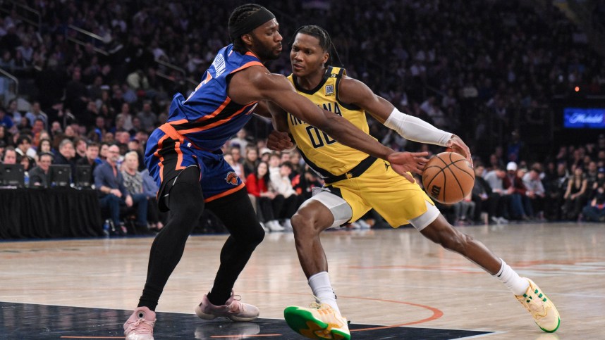 Indiana Pacers guard Bennedict Mathurin (00) drives to the basket while being defended by New York Knicks forward Precious Achiuwa (5) during the first quarter at Madison Square Garden