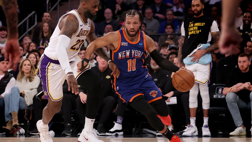 New York Knicks guard Jalen Brunson (11) drives to the basket against Los Angeles Lakers forward LeBron James (23) during the fourth quarter at Madison Square Garden