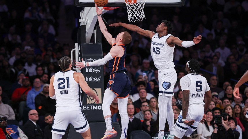 New York Knicks guard Donte DiVincenzo (0) shoots a lay up for a basket during the fourth quarter as Memphis Grizzlies forward GG Jackson (45) defends at Madison Square Garden