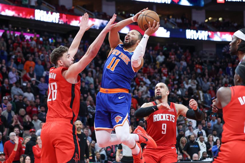 New York Knicks guard Jalen Brunson (11) attempts to score as Houston Rockets center Alperen Sengun (28) defends during the fourth quarter at Toyota Center