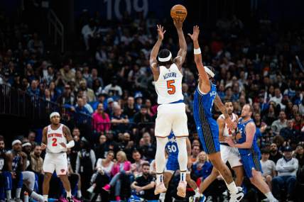 New York Knicks forward Precious Achiuwa (5) shoots the ball over Orlando Magic forward Paolo Banchero (5) in the fourth quarter at KIA Center