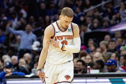 New York Knicks guard Donte DiVincenzo (0) reacts after his three pointer against the Philadelphia 76ers during the fourth quarter at Wells Fargo Center
