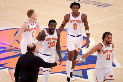 New York Knicks head coach Tom Thibodeau high fives New York Knicks forward Julius Randle (30) with guard Donte DiVincenzo (0) and forward OG Anunoby (8) and guard Jalen Brunson (11) during the first quarter against the Washington Wizards at Madison Square Garden