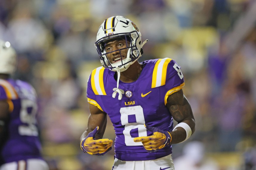 LSU Tigers wide receiver Malik Nabers (8) celebrates his 40-yard touchdown catch in the fourth quarter against the Georgia State Panthers at Tiger Stadium