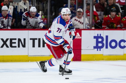 New York Rangers center Tyler Pitlick (71) skates with the puck against the Chicago Blackhawks during the first period at the United Center