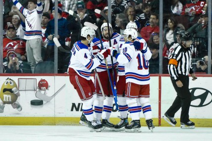 New York Rangers left wing Chris Kreider (20) celebrates with teammates after scoring a goal against the New Jersey Devils during the second period at Prudential Center