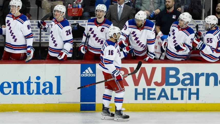 New York Rangers center Vincent Trocheck (16) celebrates with teammates after scoring a goal against the New Jersey Devils during the third period at Prudential Center