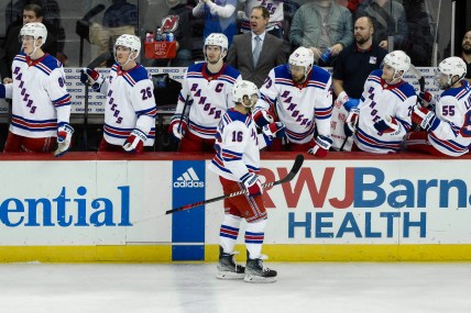 New York Rangers center Vincent Trocheck (16) celebrates with teammates after scoring a goal against the New Jersey Devils during the third period at Prudential Center