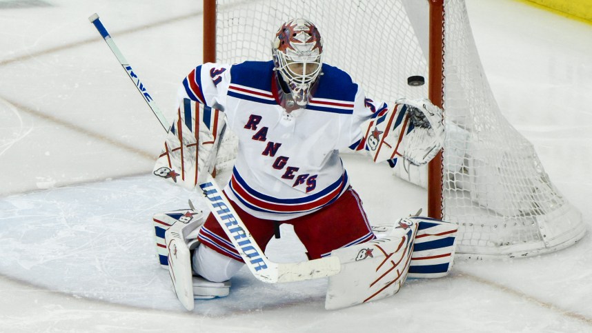 New York Rangers goaltender Igor Shesterkin (31) makes a save against the New Jersey Devils during the third period at Prudential Center