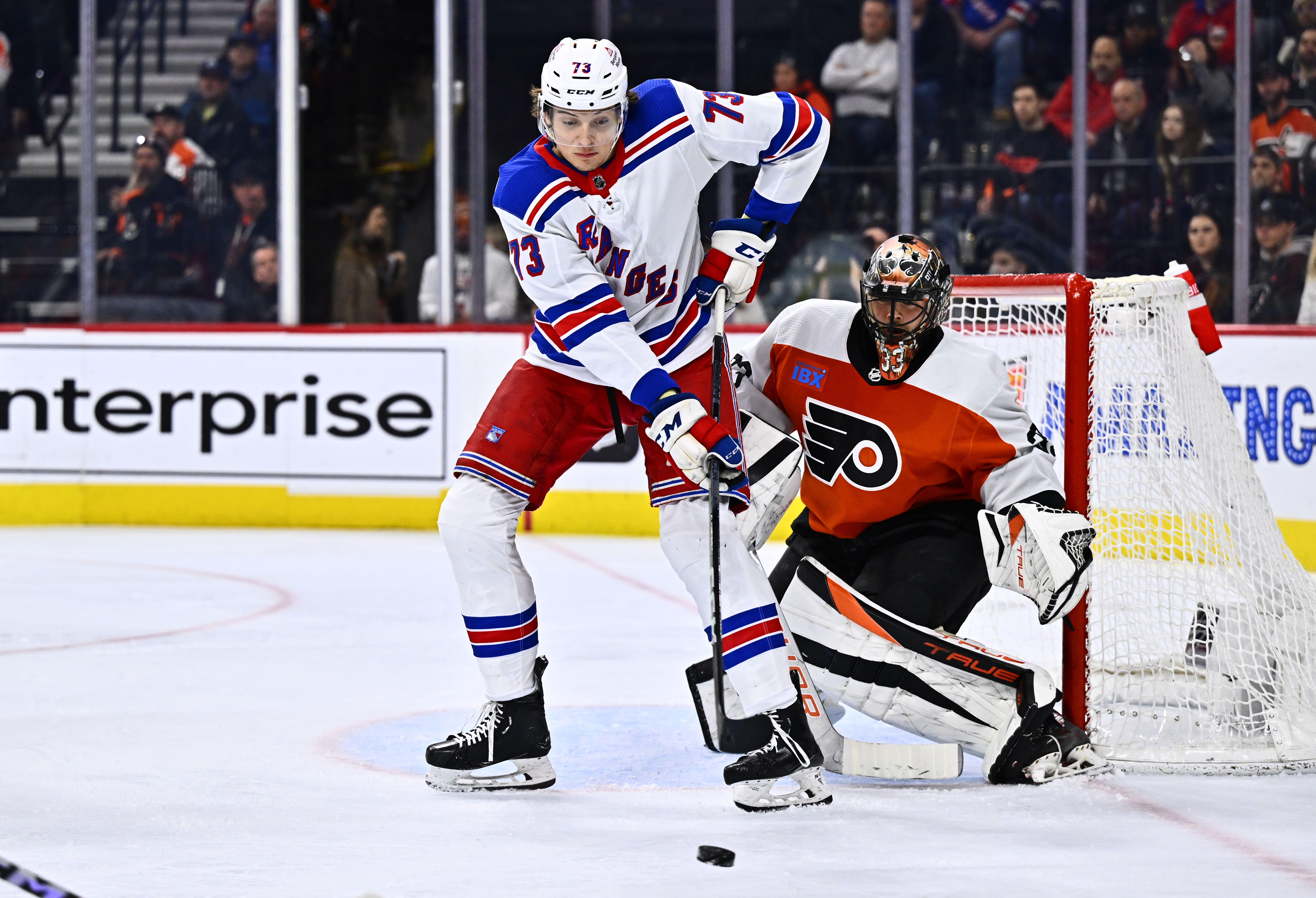 New York Rangers center Matt Rempe (73) looks to deflect the puck against Philadelphia Flyers goalie Samuel Ersson (33) in the second period at Wells Fargo Center