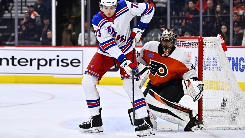 New York Rangers center Matt Rempe (73) looks to deflect the puck against Philadelphia Flyers goalie Samuel Ersson (33) in the second period at Wells Fargo Center
