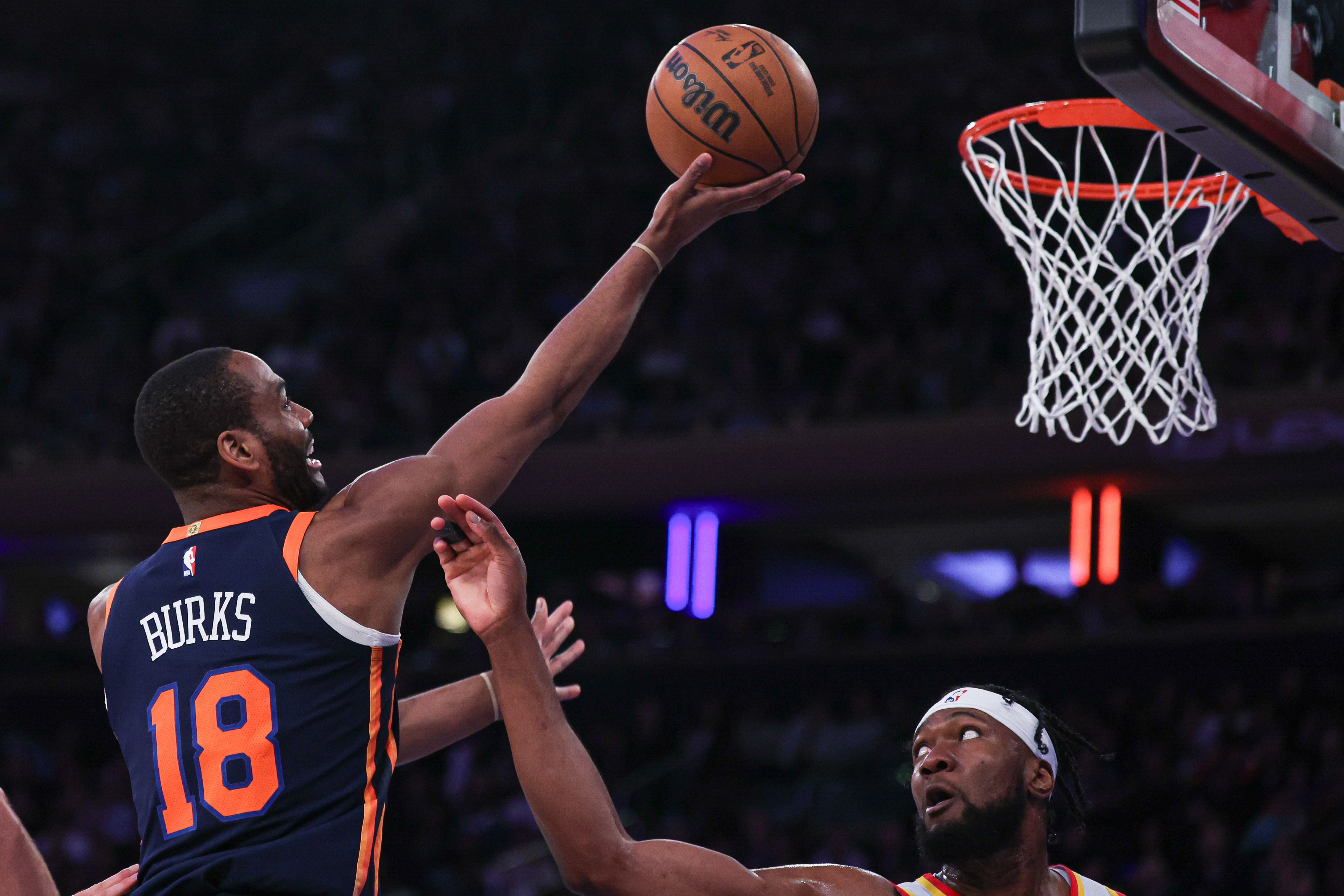 New York Knicks guard Alec Burks (18) drives for a shot against Atlanta Hawks forward Bruno Fernando (24) during the second half at Madison Square Garden