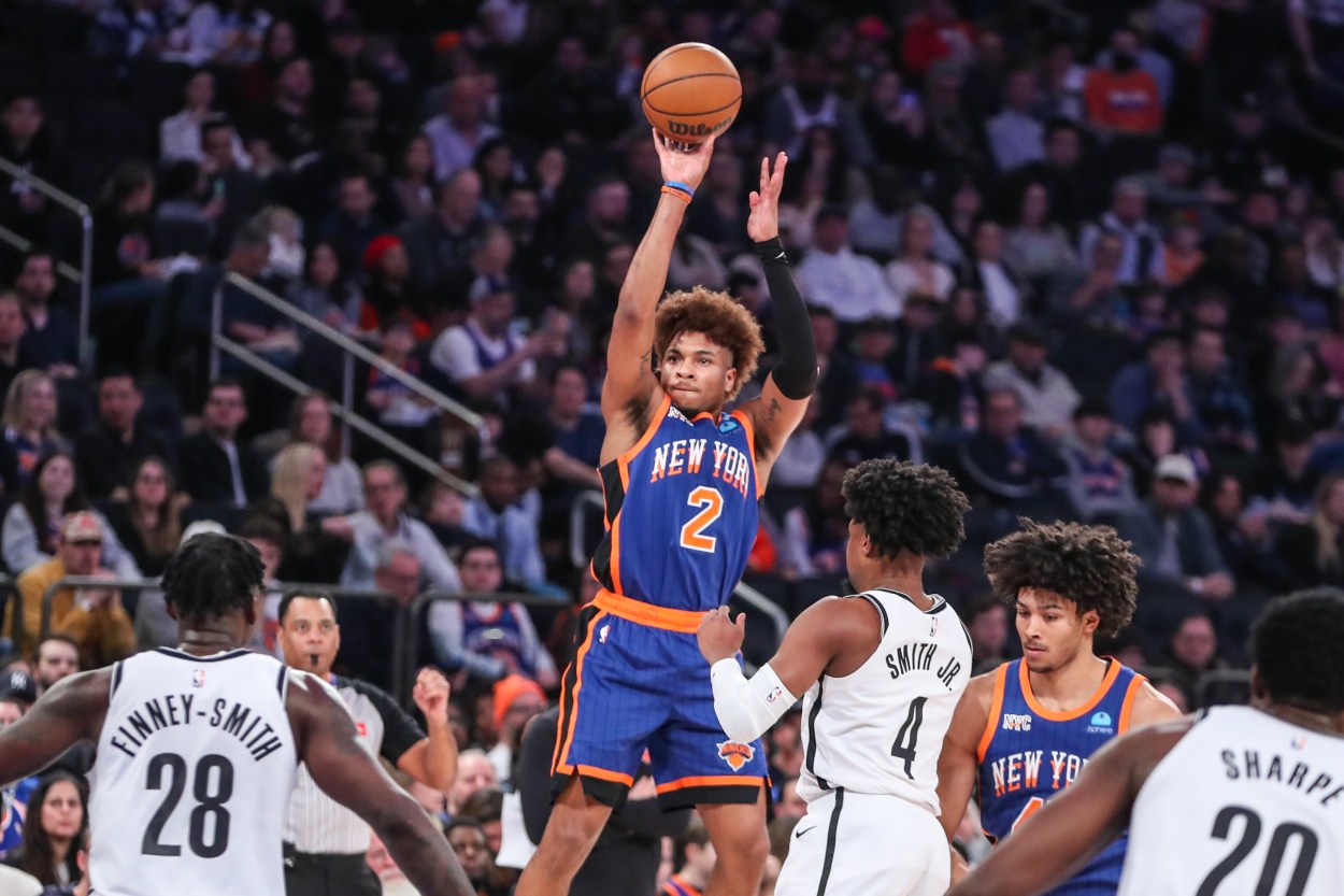 New York Knicks guard Miles McBride (2) takes a three point shot in the first quarter against the Brooklyn Nets at Madison Square Garden