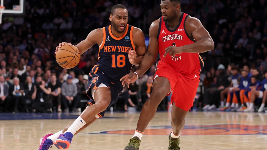 New York Knicks guard Alec Burks (18) drives to the basket against New Orleans Pelicans forward Zion Williamson (1) during the second quarter at Madison Square Garden