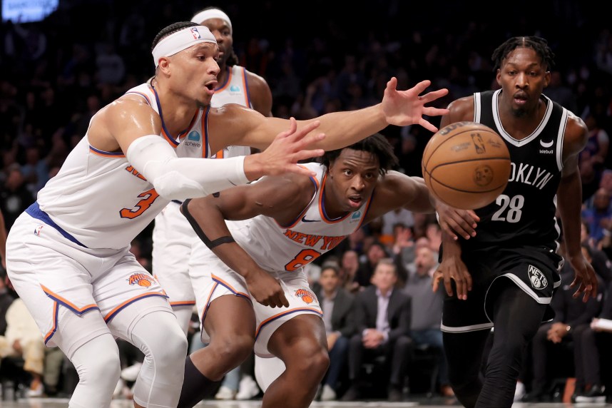New York Knicks guard Josh Hart (3) and forward OG Anunoby (8) chase a loose ball against Brooklyn Nets forward Dorian Finney-Smith (28) during the fourth quarter at Barclays Center