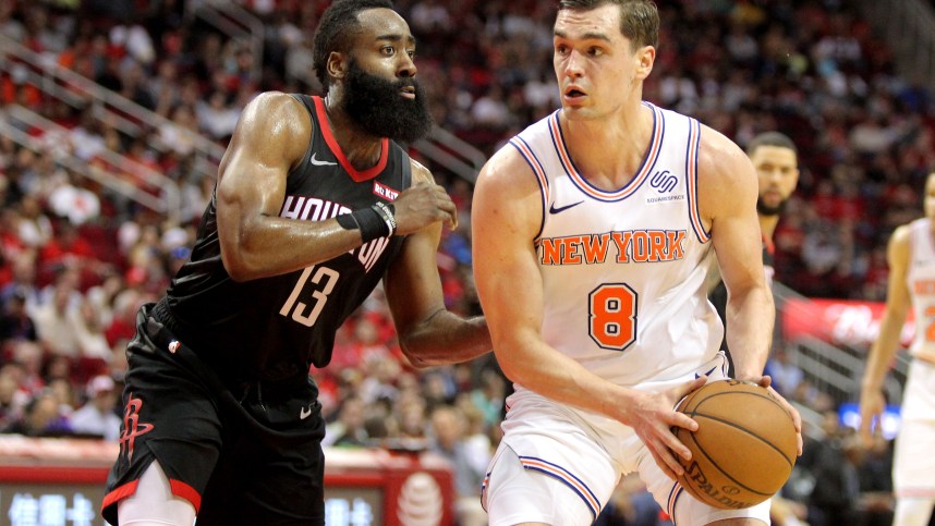 New York Knicks forward Mario Hezonja (8) handles the ball while Houston Rockets guard James Harden (13) defends during the third quarter at Toyota Center