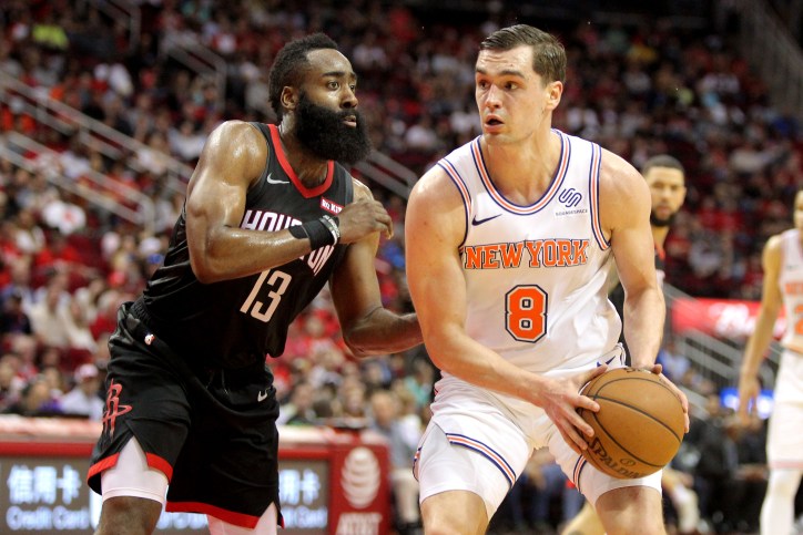 New York Knicks forward Mario Hezonja (8) handles the ball while Houston Rockets guard James Harden (13) defends during the third quarter at Toyota Center