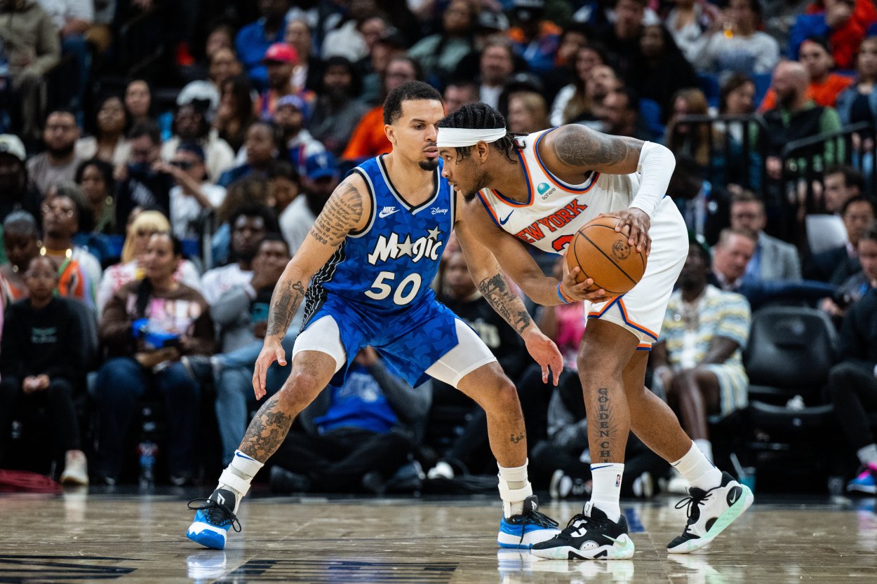 New York Knicks guard Josh Hart (3) dribbles the ball against the Orlando Magic guard Cole Anthony (50) in the fourth quarter at KIA Center. Mandatory Credit