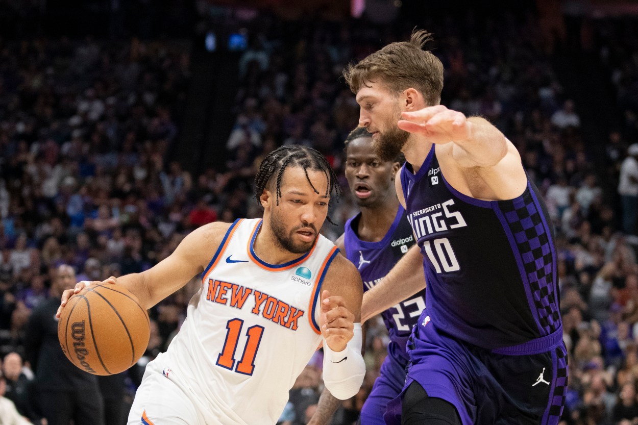 New York Knicks guard Jalen Brunson (11) dribbles the basketball against Sacramento Kings forward Domantas Sabonis (10) during the second quarter at Golden 1 Center