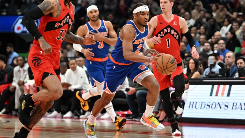 New York Knicks guard Miles McBride (2) dribbles the ball against the Toronto Raptors in the first half at Scotiabank Arena