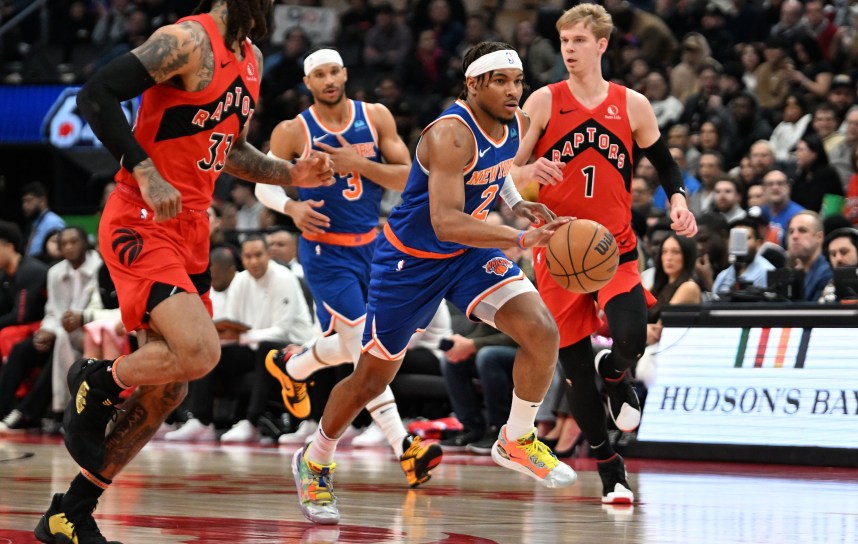 New York Knicks guard Miles McBride (2) dribbles the ball against the Toronto Raptors in the first half at Scotiabank Arena