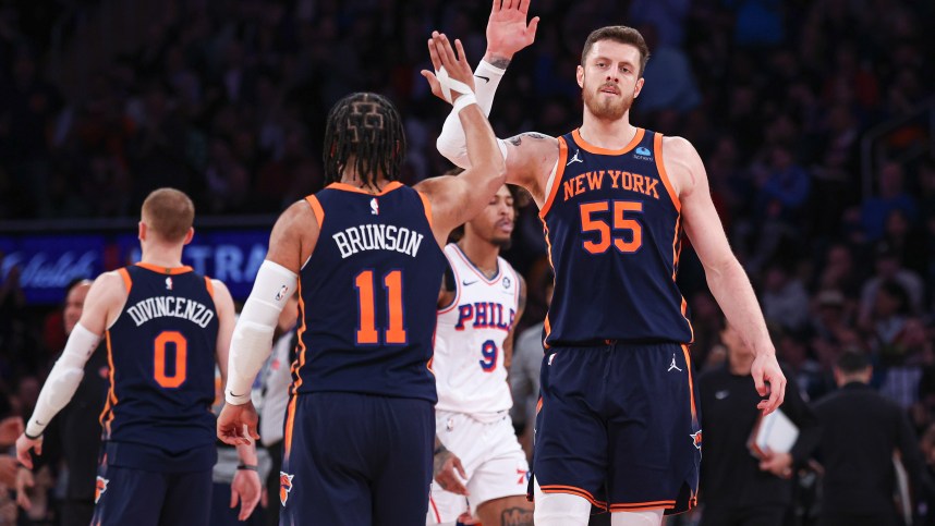 New York Knicks center Isaiah Hartenstein (55) slaps hands with guard Jalen Brunson (11) during the second quarter against the Philadelphia 76ers at Madison Square Garden