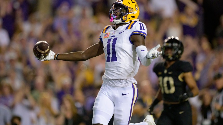 Oct 21, 2023; Baton Rouge, Louisiana, USA; LSU Tigers wide receiver Brian Thomas Jr. (11) (New York Giants draft prospect) celebrates after scoring a touchdown against Army Black Knights defensive back Cameron Jones (10) during the first quarter at Tiger Stadium. Mandatory Credit: Matthew Hinton-USA TODAY Sports