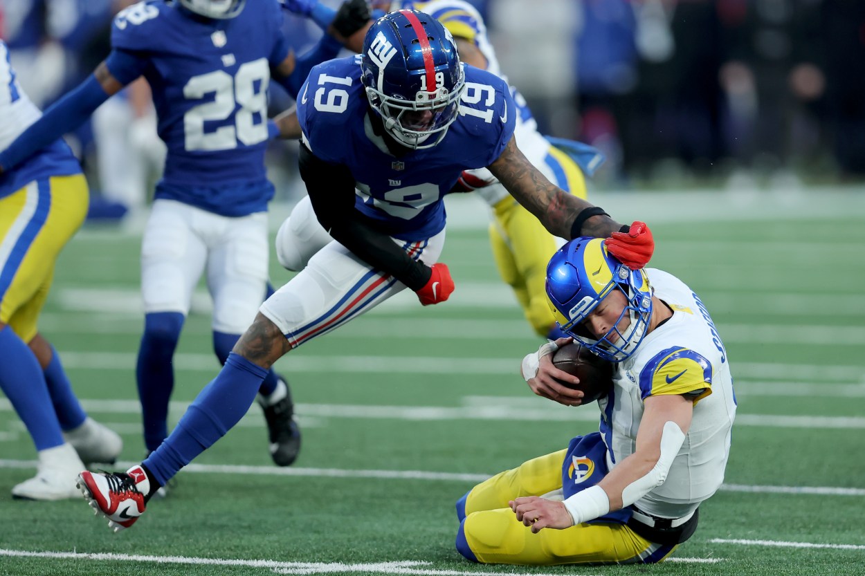 Los Angeles Rams quarterback Matthew Stafford (9) is sacked by New York Giants safety Isaiah Simmons (19) during the fourth quarter at MetLife Stadium