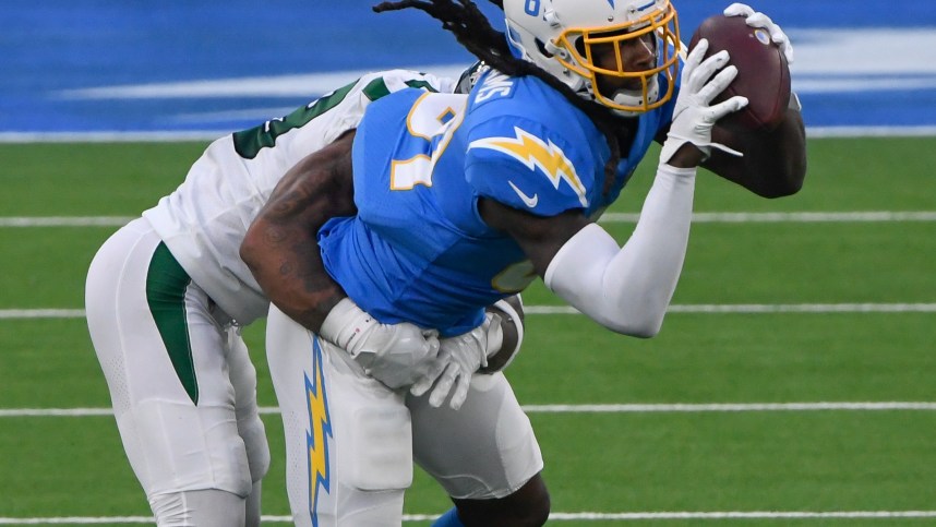 Los Angeles Chargers wide receiver Mike Williams (81) catches a pass against New York Jets cornerback Arthur Maulet (23) during the third quarter at SoFi Stadium