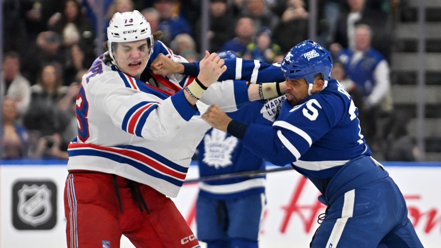 Toronto Maple Leafs forward Ryan Reaves (75) lands a punch as he fights with New York Rangers forward Matt Rempe (73) in the third period at Scotiabank Arena