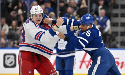 Toronto Maple Leafs forward Ryan Reaves (75) lands a punch as he fights with New York Rangers forward Matt Rempe (73) in the third period at Scotiabank Arena