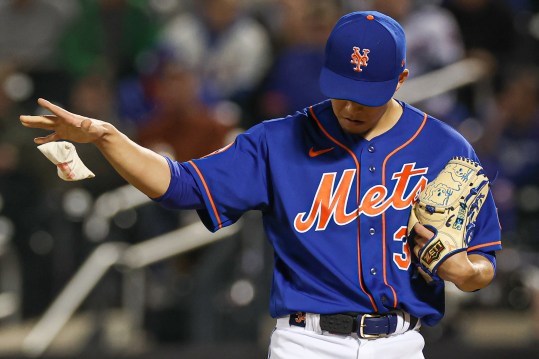 Sep 27, 2023; New York, NY, USA; New York Mets starting pitcher Kodai Senga (34) drops a rosin bag during the fifth inning against the Miami Marlins at Citi Field.  Mandatory Credit: Vincent Carchietta-USA TODAY Sports
