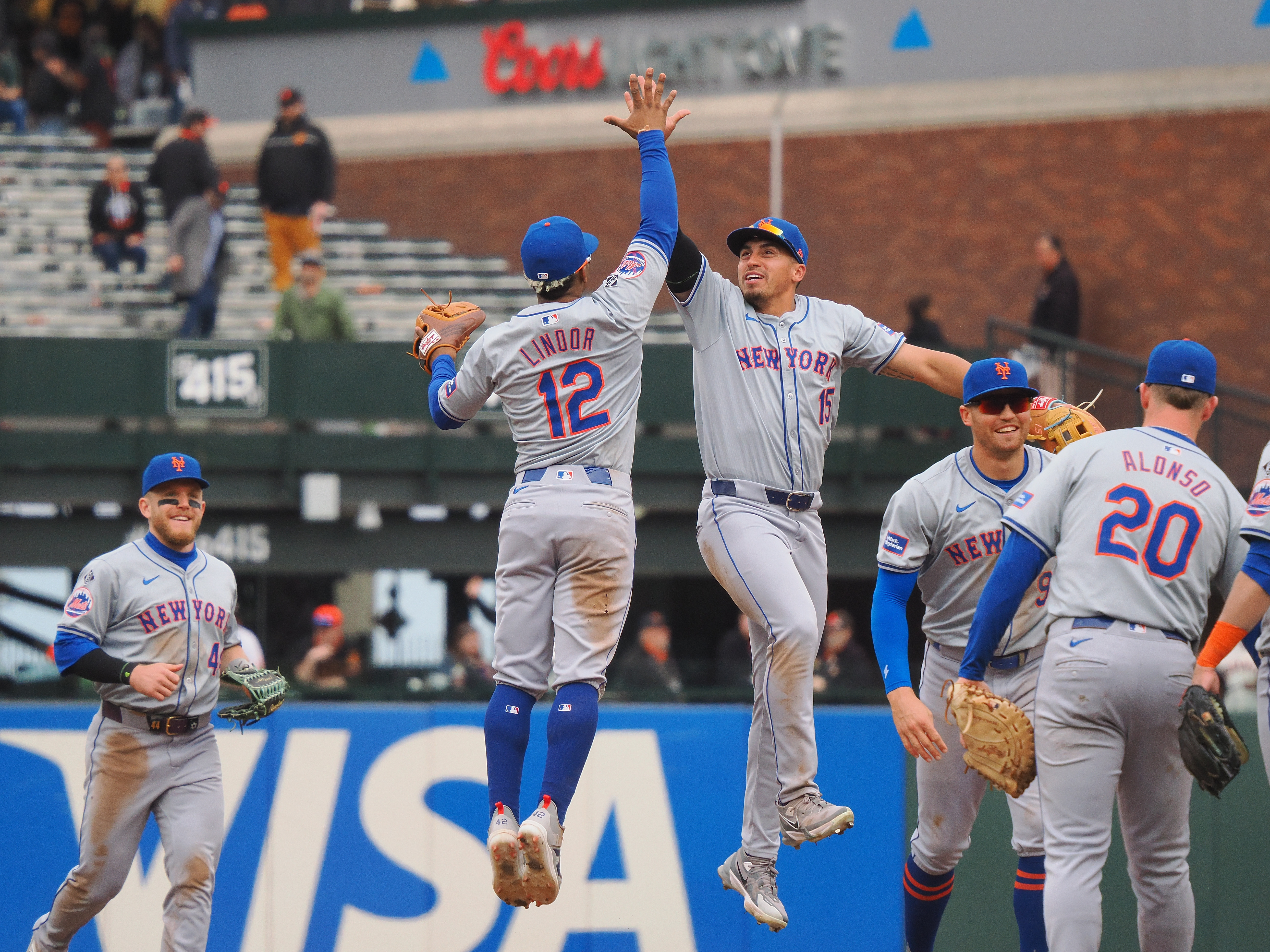 Apr 24, 2024; San Francisco, California, USA; New York Mets shortstop Francisco Lindor (12) high fives right fielder Tyrone Tyler (15) after the game against the San Francisco Giants at Oracle Park. Mandatory Credit: Kelley L Cox-USA TODAY Sports