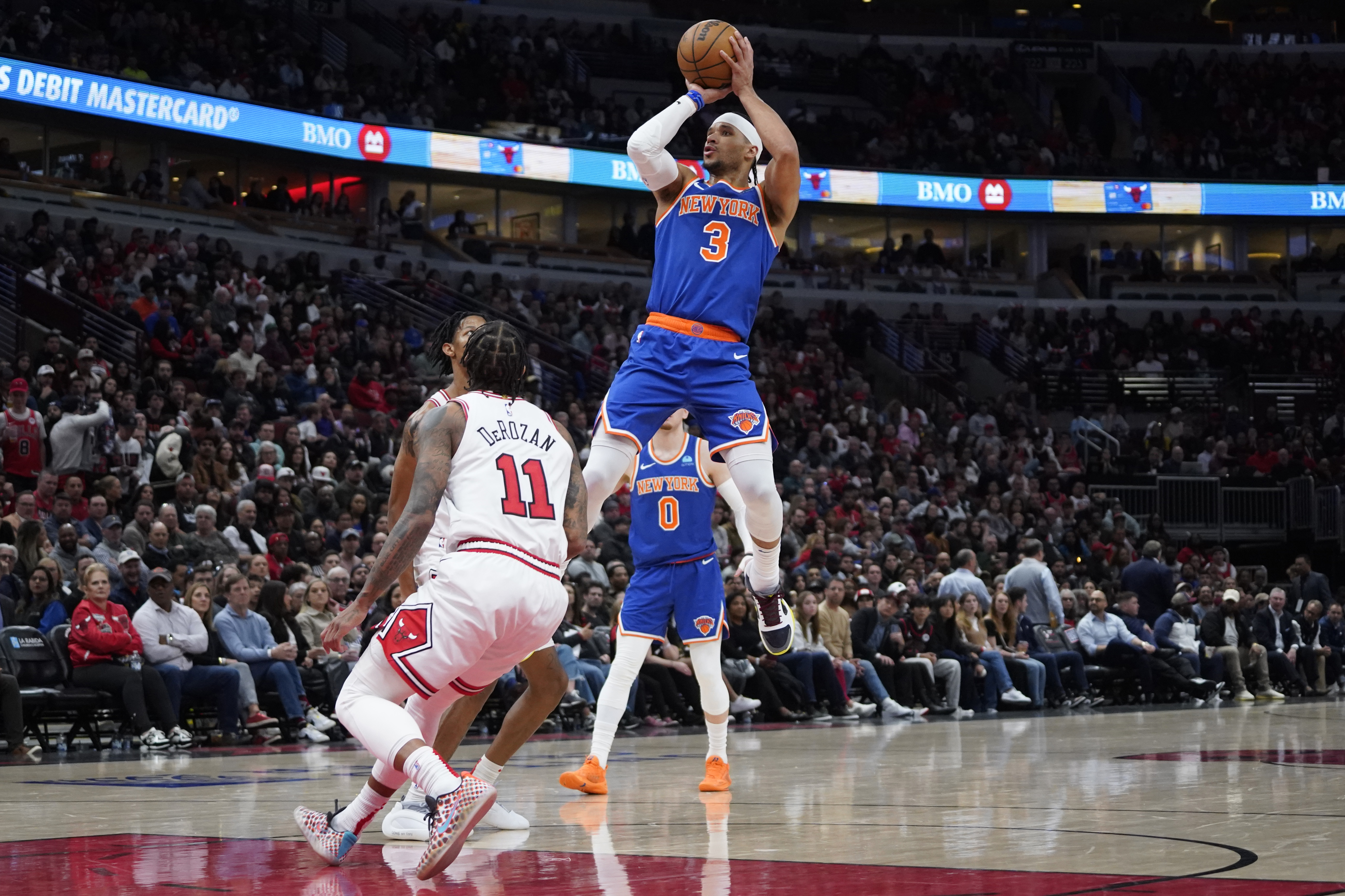 New York Knicks guard Josh Hart (3) shoots over Chicago Bulls forward DeMar DeRozan (11) during the second half at United Center