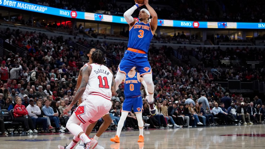 New York Knicks guard Josh Hart (3) shoots over Chicago Bulls forward DeMar DeRozan (11) during the second half at United Center