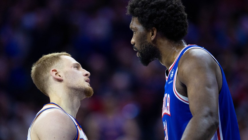 Apr 25, 2024; Philadelphia, Pennsylvania, USA; Philadelphia 76ers center Joel Embiid (21) has words with New York Knicks guard Donte DiVincenzo (L) after a play during the first quarter of game three of the first round for the 2024 NBA playoffs at Wells Fargo Center. Mandatory Credit: Bill Streicher-USA TODAY Sports