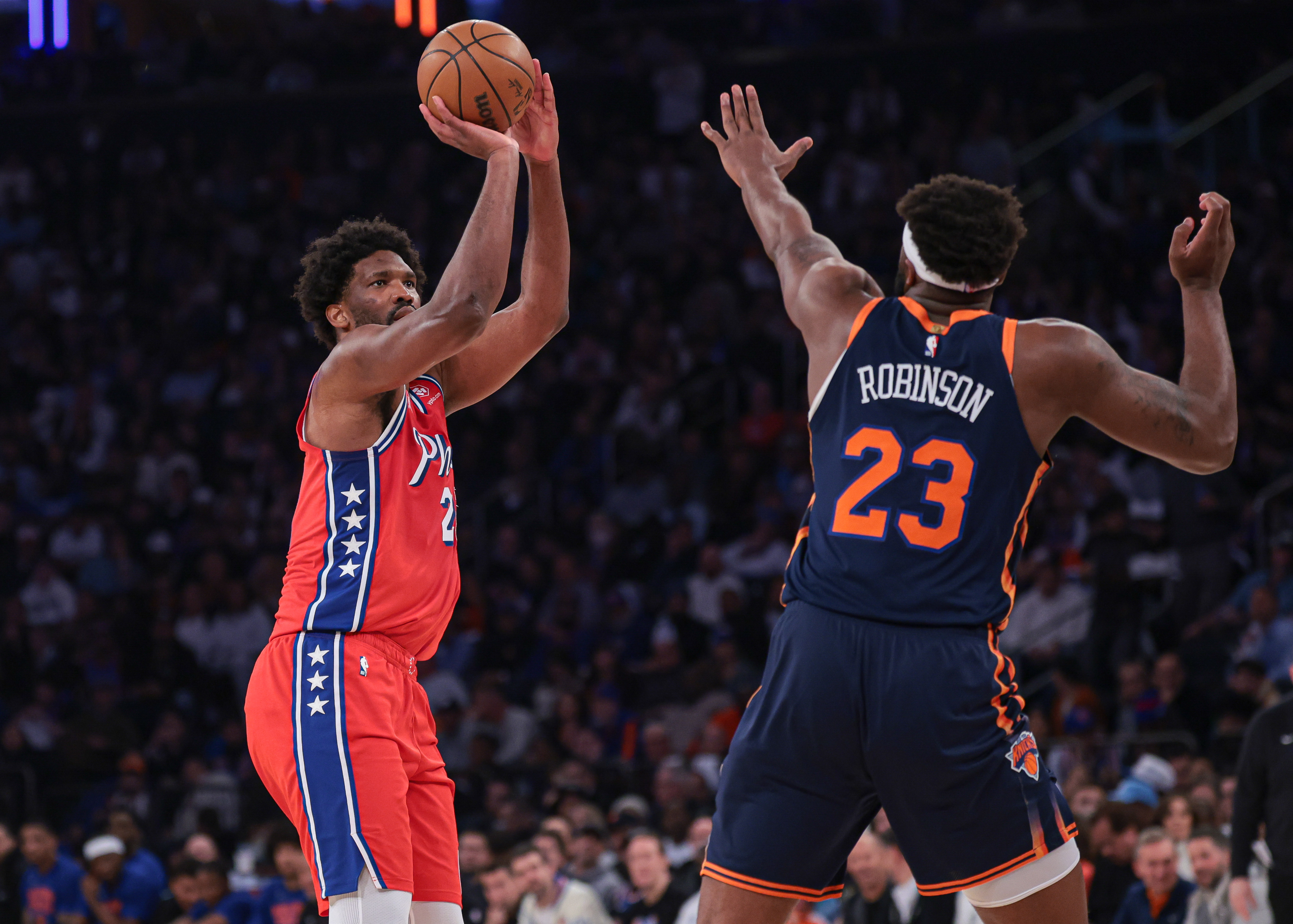 Apr 22, 2024; New York, New York, USA; Philadelphia 76ers center Joel Embiid (21) shoots the ball as New York Knicks center Mitchell Robinson (23) defends during the first half during game two of the first round for the 2024 NBA playoffs at Madison Square Garden. Mandatory Credit: Vincent Carchietta-USA TODAY Sports