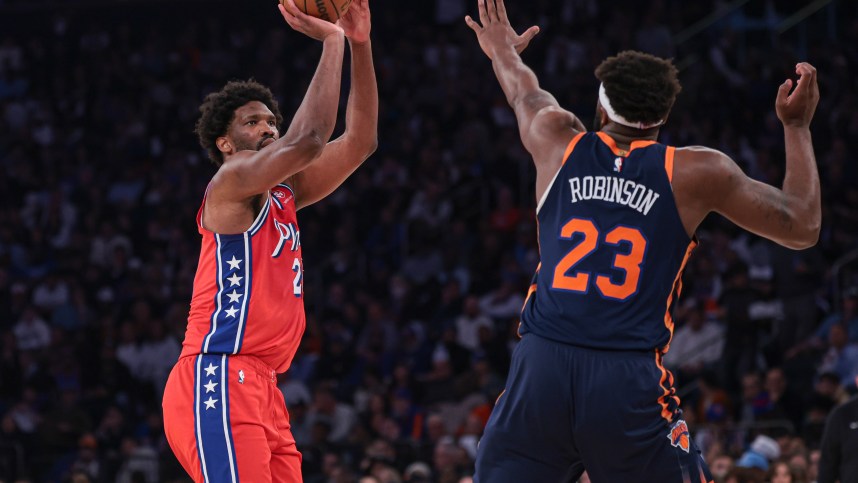 Philadelphia 76ers center Joel Embiid (21) shoots the ball as New York Knicks center Mitchell Robinson (23) defends during the first half during game two of the first round for the 2024 NBA playoffs at Madison Square Garden