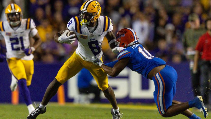 Nov 11, 2023; Baton Rouge, Louisiana, USA;  Florida Gators defensive end Kelby Collins (11) attempts to tackle LSU Tigers wide receiver Malik Nabers (8) during the second half at Tiger Stadium. Mandatory Credit: Stephen Lew-USA TODAY Sports