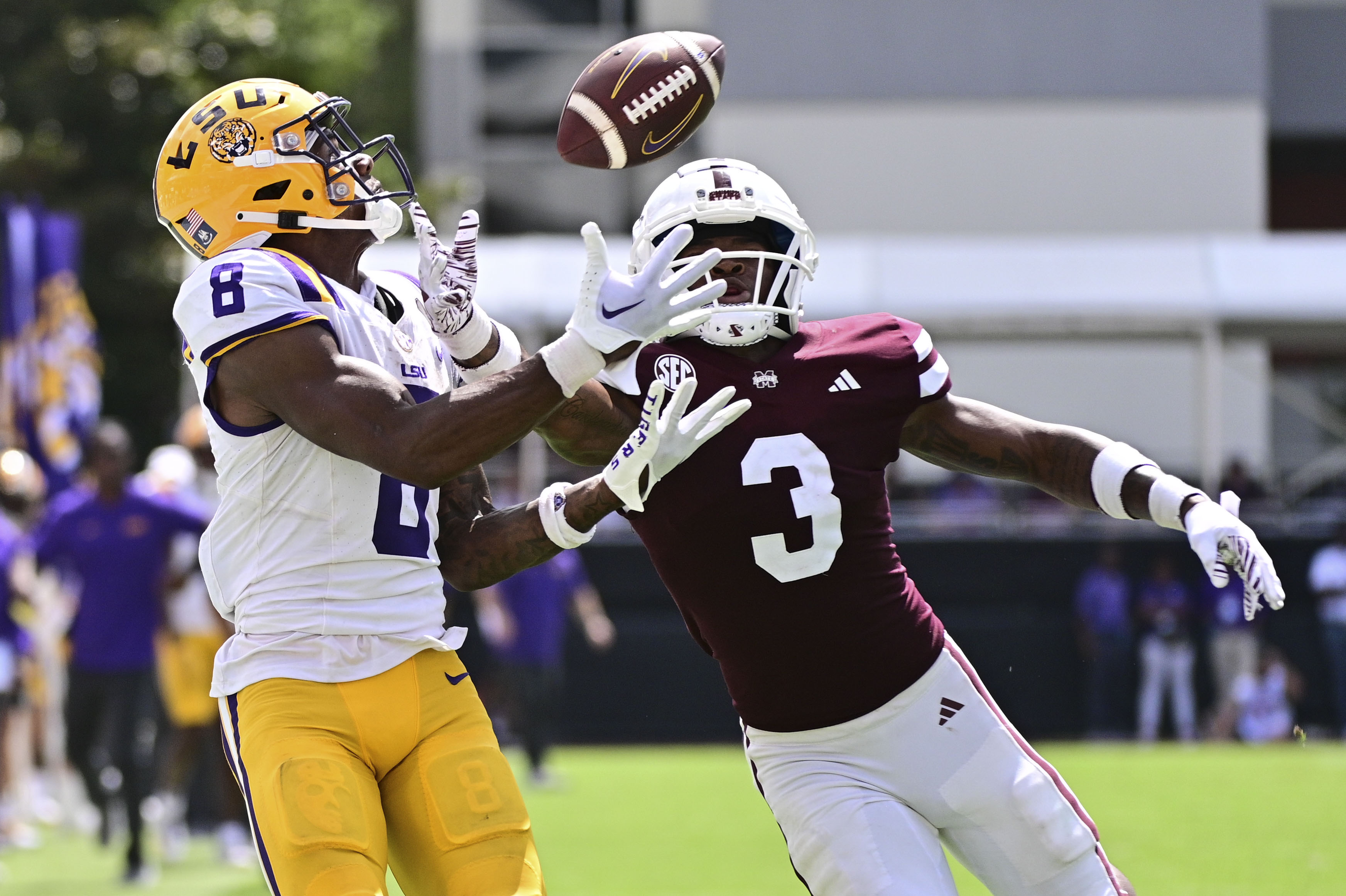 Sep 16, 2023; Starkville, Mississippi, USA; LSU Tigers wide receiver Malik Nabers (8) makes a reception while defended by Mississippi State Bulldogs cornerback Decamerion Richardson (3) on a play that would result in a touchdown during the fourth quarter at Davis Wade Stadium at Scott Field. Mandatory Credit: Matt Bush-USA TODAY Sports