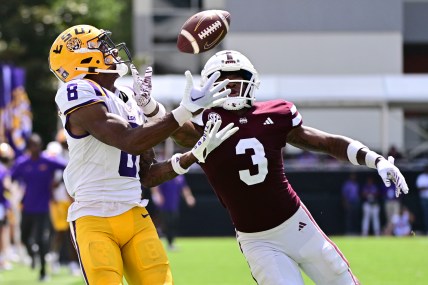 Sep 16, 2023; Starkville, Mississippi, USA; LSU Tigers wide receiver Malik Nabers (8) makes a reception while defended by Mississippi State Bulldogs cornerback Decamerion Richardson (3) on a play that would result in a touchdown during the fourth quarter at Davis Wade Stadium at Scott Field. Mandatory Credit: Matt Bush-USA TODAY Sports