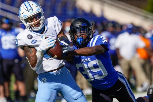 Nov 7, 2020; Durham, North Carolina, USA; North Carolina Tar Heels wide receiver Emery Simmons (0) makes a touchdown catch covered by Duke Blue Devils cornerback Jeremiah Lewis (39) during the first quarter at Wallace Wade Stadium. Mandatory Credit: Jim Dedmon-USA TODAY Sports
